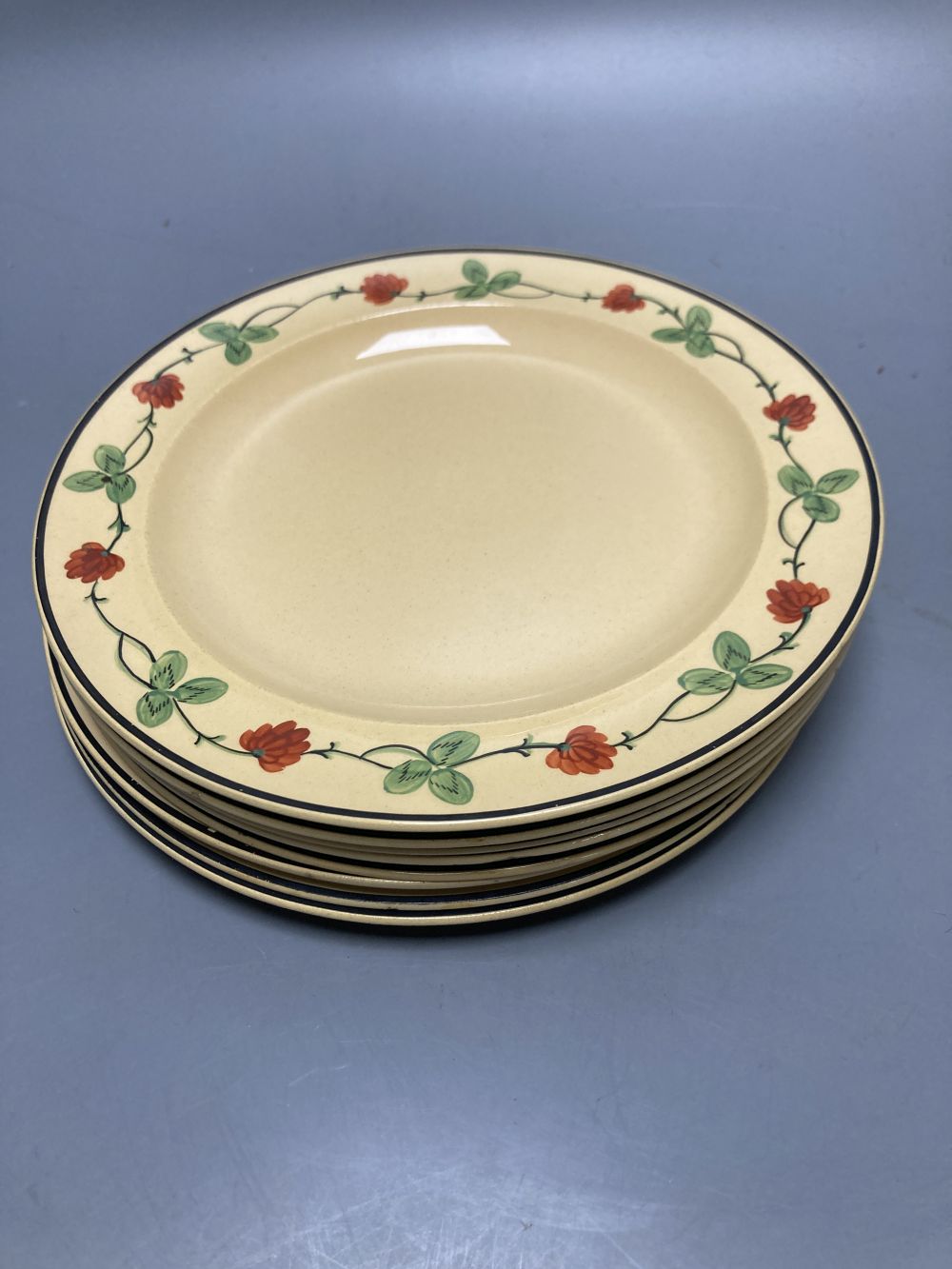 A group of Wedgwood Queensware, 19th century, including ten strawberry plates, a coaster, a jug and six drabware plates